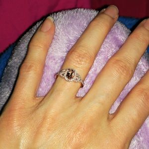 Oval Morganite and 1/6 CT. T.W. Diamond Buckle Engagement Ring in 10K

Rose Gold
